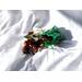 Nana's Apple Pie Sachet laid out on a white bed sheet with sun and shadows adding to the professional look of this image.